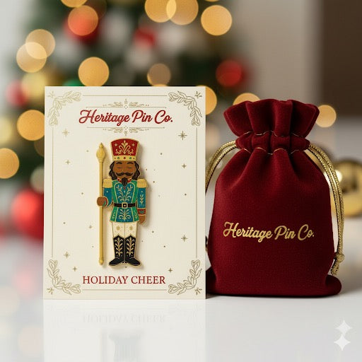 Nutcracker enamel pin on Heritage Pin Co. backer card with velvet gift bag, holiday collectible